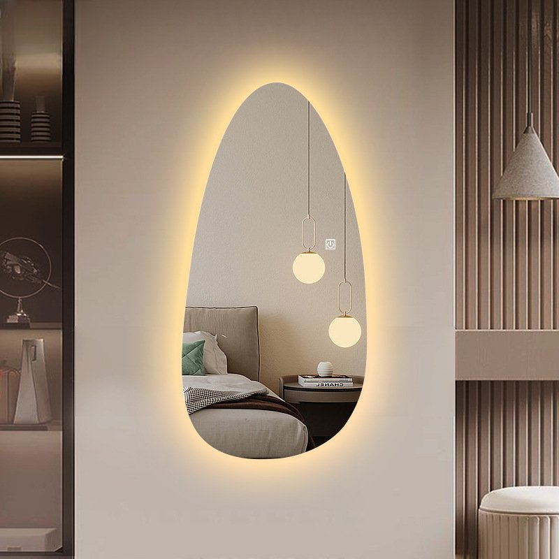 Asymmetrical backlit LED mirror